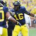 Michigan senior quarterback Denard Robinson celebrates on the sidelines after Devin Gardner scored a touchdown in the first quarter against Northwestern at Michigan Stadium on Saturday. Melanie Maxwell I AnnArbor.com